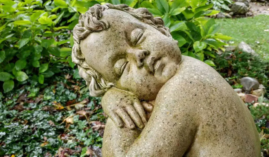 Sleeping boy garden statue